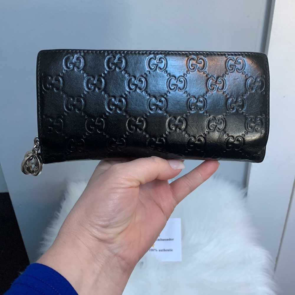 Black silver Gucci wallet with charm